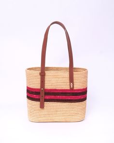 this stunning raffia handmade bag to our customers. This versatile bag can be used as both a shoulder bag and a handbag, making it the perfect accessory for any woman. The natural and eco-friendly raffia material used in this bag makes it a great choice for those who value sustainability. The bag comes in natural raffia color and black , so you can choose the one that best suits your personal style. Our skilled artisans have crafted this bag with traditional techniques and attention to detail, ensuring a high-quality product that is both durable and stylish. Not only will you love the way this bag looks and feels, but you will also feel good knowing that you are supporting traditional craftsmanship and preserving Moroccan culture through your purchase. This raffia handmade bag is a must-ha Eco-friendly Bag With Adjustable Strap And Natural Fiber, Eco-friendly Natural Fiber Bag With Adjustable Strap, Eco-friendly Bags With Adjustable Strap, Everyday Natural Fiber Shoulder Bag With Adjustable Strap, Natural Fiber Bag With Adjustable Strap, Natural Fiber Bags With Adjustable Strap, Woven Jute Shoulder Bag With Top Handle, Rectangular Everyday Bag In Natural Fiber, Shoulder Bag With Adjustable Strap In Natural Fiber