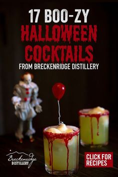 two halloween cocktails in glasses with red and white drizzle on the top