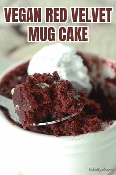 a close up of a spoon in a bowl of food with the words vegan red velvet mug cake