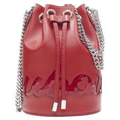 CHRISTIAN LOUBOUTIN Marie Jane red signature logo bucket crossbody bag Reference: TGAS/B00238 Brand: Christian Louboutin Model: Marie Jane Material: Leather Color: Red Pattern: Solid Closure: Drawstring Lining: Leather Extra Details: Marie Jane. Red calf leather upper. Red patent signature design. Silver-tone hardware. Drawstring closure. Silver-tone chain shoulder strap can be adjusted between shoulder length of crossbody length. Estimated Retail Price: USD 1880 Made in: Italy CONDITION: Condit Bag Reference, Louboutin Bags, Western Purses, Christian Louboutin Women, Ladies Handbags, Leather Bucket Bag, Leather Bucket, Red Pattern, Signature Logo