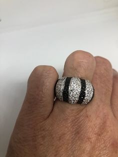 Vintage black and white sapphire ring 925 Sterling Silver Setting Size 6.5 Can be resized, my jeweler charges $10-$20 All rings are shipped free in the US in a nice gift box. Check out our over a THOUSAND great reviews Engraving is $4 per letter and is not always perfect depending on the piece. It can take a few days if the jeweler is busy. This is payable to Paypal Judithsltd@gmail.com Gift Black Diamond Sterling Silver Ring, Black Channel Set Rings For Anniversary, Anniversary Black Channel Set Rings, Black Jewelry With Pave Setting For Gift, Black Diamonds Round Diamond Ring For Gift, Gift Black Diamond Round Ring, Black Diamonds Cubic Zirconia Rings As Gift, Cubic Zirconia Rings With Black Diamonds As Gift, Gift Black Diamond Ring