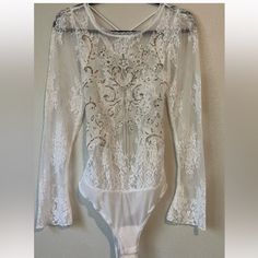 Gorgeous Lace Body Suit With Silver Sequin Detail And Laced Open Back - Brand New With Tags Perfect For Holidays Sold Out Online ! Summer Lace Bodysuit For Night Out, Backless Party Bodysuit With Lace Trim, Party Backless Bodysuit With Lace Trim, Backless Bodysuit With Lace Trim For Party, Party Lace Trim Backless Bodysuit, Party Lace Bodysuit With Lace Trim, Long Sleeve Lace Bodysuit For Party, Summer Party Lace Bodysuit, Lace Fitted Bodysuit For Party