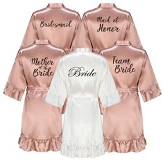 Wedding Party Team Bride Robe With Black Letters Kimono Satin Bridesmaid Personalized Bathrobe Bridal Party Package: 1x bathrobe 🤍PRODUCT DIMENSIONS🤍 Please refer to the listing's photo.  🤍SHIPPING🤍 Estimate Delivery Time: 10-15 working days worldwide. This is an estimate only. We always try our best to have your item(s) delivered on time however sometimes there might be some delays which are beyond our control. Your understanding in such circumstances will be greatly appreciated. 🤍REVIEWS Satin Gown For Bridal Shower, Elegant Satin Dresses For Bachelorette Party, Pink Long Sleeve Wedding Robe, Bridesmaid Robes Personalized, Bridesmaid Bathrobe, Personalized Bathrobe, Bridesmaid Robe Personalized, Rose Gold Satin, Clothing Gifts