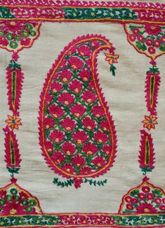 This is an antique Surat area embroidery from Gujarat, Indian in sumptuous green and pink dyed silk. The pink silk is cochineal and the green is from a combination of indigo and a yellow bearing plant. The design is in a beautiful boteh design filled with small flowers and framed by long serrated leaves forming a column between each boteh. It was probably made as a shawl with the boteh, or paisley, designs being on the end of the shawl or a hanging in and of itself with two pieces joined togethe Embroidered Pink Raw Silk Traditional Wear, Pink Embroidered Raw Silk Traditional Wear, Pink Raw Silk Embroidered Fabric In Traditional Drape, Pink Raw Silk Embroidered Fabric With Traditional Drape, Pink Raw Silk Fabric With Traditional Drape, Transitional Season Embroidered Pink Saree, Pink Embroidered Raw Silk Saree, Pink Raw Silk Embroidered Saree, Transitional Green Raw Silk Embroidered Fabric