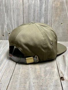 7 Panel Upland Patch All Loden Cap Cotton Twill Front Structured 7 Panel Crown Brass Metal Eyelets Mid/High Crown Flat Bill Premium Leather Strapback Military Style Baseball Cap With Flat Brim, Military Style Brown Baseball Cap With Flat Bill, Vintage Flat Bill Baseball Cap For Outdoor Activities, Vintage Snapback Hat With Flat Bill For Outdoor Activities, Vintage Snapback Hat With Flat Bill For Outdoor, Vintage Flat Bill Snapback Hat For Outdoor, Adjustable Six-panel Snapback Hat For Outdoor, Adjustable Six-panel Snapback Hat For Outdoor Activities, Military Snapback Hat With Flat Bill For Outdoor