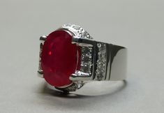 Red Ruby 925 Sterling Silver Handmade Channel Set Ring Product Type: Ring Ring Sizes: 5 US, 6 US, 7 US, 8 US, 9 US, 10 US, 11 US, 12 US, 13 US, 14 US, 15 US, 16 US Metal Type: 925 Sterling Silver Gemstone: 5 Carat Ruby, Yaqoot Gemstone Color: Red, Lal Yaqoot Gemstone Type: Lab-Created (High-Quality) Rubies, the birthstone of July, are considered the king of gems and represent love, health, and wisdom. It was believed wearing a fine red Ruby bestowed good fortune on its owner and it's one of the Red Oval Stone Ring, Elegant Red Rings With Stones, Formal Red Gemstone Ring, Red Stone Rings For Anniversary, Formal Red 925 Stamped Rings, Formal Red Sterling Silver Rings, Red Ruby Ring, July Birthstone Ring, Set Ring