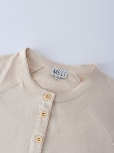 Our Henley Drawstring Tee in tan is the perfect combination of style and comfort. The drawstring style with the buttons makes this tee a must have in your closet! The tan color effortlessly makes this tee stand out even more! Casual Beige Top With Buttons, Beige Relaxed Fit Top With Buttons, Casual Beige Tops With Button Closure, Neutral Cotton Button-up Tops, Beige Relaxed Fit Button-up Top, Cotton Cream Tops With Button Closure, Cream Cotton Tops With Button Closure, Beige Button-up Top For Everyday, Neutral Button-up Tops For Everyday