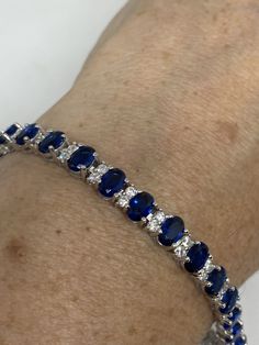 Vintage Cubic Zirconia Bracelet Clear blue Crystal Tennis 7.5 inches All jewelry is shipped free in the US in a nice gift box. Check out our over a THOUSAND great reviews Engraving is $4 per letter and is not always perfect depending on the piece. It can take a few days if the jeweler is busy. This is payable to Paypal Judithsltd@gmail.com Classic Blue Diamond Bracelet, Blue Formal Tennis Bracelet, Formal Blue Tennis Bracelet, Blue Sapphire Round Bracelet, Luxury Blue Sapphire Bracelets, Luxury Blue Gemstone Tennis Bracelet, Formal Blue Diamond Bracelet, Blue Jubilee Tennis Bracelet For Anniversary, Blue Oval Tennis Bracelet For Formal Occasions