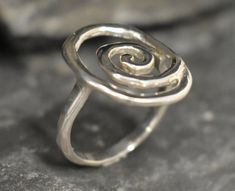 Silver Infinity Ring made of Solid 925 Sterling Silver ☞ made to last.Click here for ☞ Matching Earrings﻿Details:• Large Silver Swirl Ring • Dimensions: Band Width 2.1mm Thickness 1mm• Solid 925 Sterling SilverSKU 1643 Modern Twist Spiral Jewelry For Anniversary, Hand Forged Spiral Ring As Gift, Hand Forged Spiral Ring For Gift, Hand Forged Spiral Ring, Hand Forged Spiral Rings For Gifts, Hand Forged Spiral Jewelry For Anniversary, Spiral Sterling Silver Wedding Ring, Gift Spiral Ring With A Modern Twist, Modern Twist Swirl Jewelry As Gift