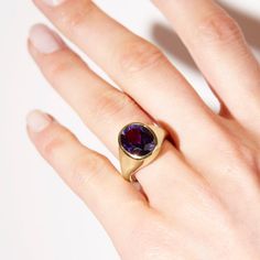 Take your style to a higher level with the magnificent Aphrodite statement ring featuring an oval amethyst made with Fairmined 18k yellow gold by Chroma. • Fairmined 14k yellow gold • 4.90ct Oval Amethyst • Band Width: 2mm - 6mm • In stock in size 6. This ring is able to be resized, please allow 4 weeks. Designed and crafted by us in NYC using recycled gold, conflict-free diamonds and responsibly sourced gemstones. The Fairmined program certifies gold created by small scale mining organizations, Modern Gold Amethyst Gemstone Ring, Oval Amethyst Ring In Yellow Gold With Polished Finish, Oval Yellow Gold Amethyst Ring With Polished Finish, Modern Yellow Gold Amethyst Gemstone Ring, Modern Yellow Gold Amethyst Ring, Timeless Gold Amethyst Ring, Elegant Purple Amethyst Signet Ring, Timeless Gold Oval Amethyst Ring, Timeless Oval Gold Amethyst Ring