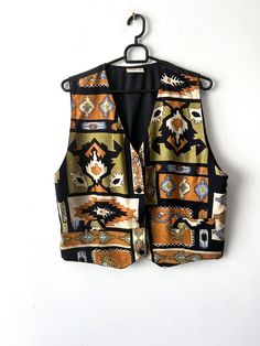 "Vintage Women's summer vest Patterned viscose Vest Button Up Waistcoat Hippie Festival Vest Size Large Retro vest 90s lady vest Label size: 40 Estimated size: L Measurements (lying flat): Length: 20.5\"/ 51 cm Pit to pit: 21\"/ 53.3 cm Waist: 19\"/ 48 cm Please check measurements to insure a proper fit. Remember to allow yourself some extra room for movement. You can compare these with something from your closet that fits you well. This vest will come to you freshly laundered and ready to wear. Please convo me if you need additional measurements. Condition: great Vintage Condition Label: memories SHIPPING * I ship worldwide via Priority mail (Latvijas Pasts) from Latvia (EU). * I ship from Europe, so please allow 2 to 4 weeks for the package to arrive if you live overseas. * Europe 5 - 10 Retro V-neck Vest For Spring, Summer Multicolor V-neck Sweater Vest, Vintage Multicolor Sleeveless Sweater Vest, Bohemian Sleeveless Vest With Buttons, Vintage Sleeveless Sweater Vest With Buttons, Retro Multicolor Sleeveless Vest, Retro Fitted Vest For Summer, Retro Sleeveless Spring Vest, Retro Fitted Summer Vest