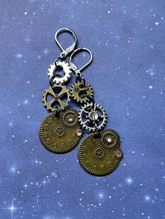 These super cute Victorian future time travel princess, mixed metal earrings are super adorable.  They have so much detail and uniqueness to them.  The Leverback is 100% stainless steel. Perfect gift for yourself or your favorite steam punk princess friend!  I made  this adorable line of steampunk cuties into six uniquely designed styles! I hope you love them all ⚙️♥️✨ Gold Steampunk Earrings, Surgical Steel Drop Earrings As Gift, Surgical Steel Drop Earrings For Gift, Steampunk Gold Dangle Jewelry, Steampunk Metal Earrings For Gift, Steampunk Style Dangle Jewelry, Steampunk Brass Jewelry For Pierced Ears, Nickel Free Metal Steampunk Earrings, Steampunk Dangle Earrings For Pierced Ears