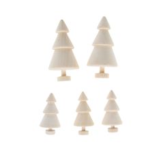 six small white plastic christmas trees on wooden bases, all in different shapes and sizes