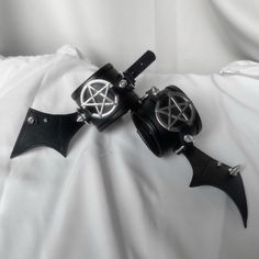 This is a dark pentagram bat wing wristband armlet punk bracelet， it is very cool and suitable for matching with punk-style clothing.  The price includes only a pair of bracelets, other items are not included. Gothic Black Wristband For Halloween, Gothic Silver Adjustable Wristband, Gothic Adjustable Silver Wristband, Gothic Style Adjustable Silver Wristband, Black Metal Gothic Wristband, Silver Gothic Adjustable Wristband, Adjustable Silver Gothic Wristband, Gothic Silver Metal Leather Bracelet, Black Grunge Bracelets For Festivals