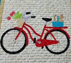 a red bicycle with flowers and a basket on the front is featured in this quilt pattern