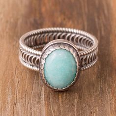 Exuding power an oval of sky blue amazonite is framed by sterling silver. Peruvian artisan Carlos Yauri creates this cocktail ring which circles the finger with an openwork sterling band. Soldered Jewelry, Amazonite Ring, Soldering Jewelry, Unique Bands, Silver Spinner Rings, Filigree Earrings, Sterling Silver Filigree, Ring Oval, Children Clothes