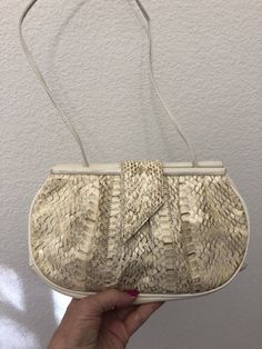 "Super cute bag for year round use. With linen summer outfits in neutral shades of ivory or taupe or tan or grey. Or in winter with winter whites and greys. Perhaps used one time. A tiny bit of scraping on the top frame to left of clasp. And inside there are a couple of tiny pen marks, way down in a corner. Front and back of bag is genuine snake skin in beige and grey shades. Not dry or flaky. Along the sides and bottom and on the top frame the leather color is light beige or ivory. Hidden snap Cream Shoulder Bag For Summer Evenings, Spring Cream Clutch Shoulder Bag, Cream Shoulder Bag For Spring Evening, Cream Shoulder Bag For Evening In Spring, Spring Evening Beige Shoulder Bag, Cream Crossbody Clutch For Evening, Evening Cream Crossbody Clutch, Cream Summer Formal Bags, Elegant Cream Crossbody Clutch