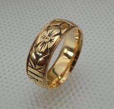 "Return Policy: If the item is as described on the listing, there's a $35.00 charge for the postage and handling that will be deducted from the refund.    Style: TEB111 Some of our jewelry is ready to send out within one or two days. Email and ask us about this listing. We make this wheat pattern wedding band in 14k and 18k white, rose and yellow gold.  The Band is hand carved all the way around and high polished.  It is around 6 mm wide and 1.5 mm thickness with a very comfort-fit edges.  We ca Carved Gold Wedding Band, Luxury 14k Stamped Round Band Wedding Ring, 14k Gold Jewelry With Intricate Design For Marriage, Classic Yellow Gold Jewelry For Ceremonial Wedding, Victorian Engraved Ring With Polished Finish For Wedding, Heirloom Engraved Ring With Diamond Cut For Ceremonial Occasions, Yellow Gold Marriage Ring With Decorative Band, White Gold Wedding Rings With Hallmarks, Traditional Hallmarked Engraved Ring For Formal Occasions