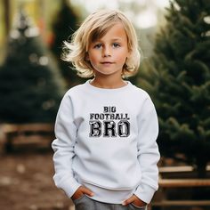 Looking for a cute sweatshirt for your kids? We have the perfect Big Football Bro graphic sweatshirt addition to their closet! Also available in toddler sweatshirts. White School Spirit Sweatshirt With Ribbed Cuffs, White Sweatshirt With Ribbed Cuffs For School Spirit, School Spirit Long Sleeve Sweatshirt With Logo, White Sweatshirt With Text Print For School Spirit, White Long Sleeve Sweater With Name Print, White Sweater With Name Print For Fall, White Fall Sweater With Name Print, Nasa Logo, Kids Clothes Boys