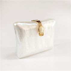 Introducing the Bulan Pearlescent Acrylic Evening Clutch Bag, a luxurious addition to your eveningwear. Crafted from shimmering and sparkling pearlescent acrylic, it adds a hint of elegance to any special evening or bridal look. With its classic silhouette, it's perfect for carrying just the essentials and is sure to make a statement. Size: L18cm x H15cm x D5cm (W7" x H6" x D2") Gender: WOMEN Item Type: Evening Bag, Box Clutch, minaudiere Pattern Type: Striped, Geometry Occasion: Versatile Main Clutch Purse Pattern, Bridal 2023, Bridal Clutch Purse, Acrylic Box Clutch, Wardrobe Refresh, Pearl Clutch, Acrylic Clutch, Bridal Purse, Luxury Clutch