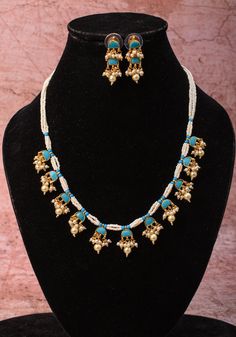 Feroza with its charming hue is sure to captivate one and all.  Introducing the elegant Feroza Lightweight Ahmedabadi Jadau Necklace and Earrings Set, featuring 11 dangling units, a fusion of timeless charm and modern sophistication. Crafted with exquisite attention to detail, this set embodies the essence of Ahmedabad's traditional craftsmanship in a lightweight design. Note: This jewelry has no precious metals or stones. Note: Some of the pics are close up shots to show detail and may make the Jadau Necklace, Necklace And Earrings Set, Necklace And Earrings, Ahmedabad, Earrings Set, Precious Metals, Earring Set, Favorite Jewelry, Close Up