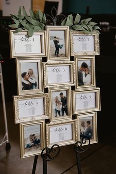 a wedding photo display with pictures and greenery on it's easel for the guests to sign