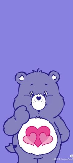 a blue teddy bear holding a pink heart in its paws on a purple background with the word love written below it