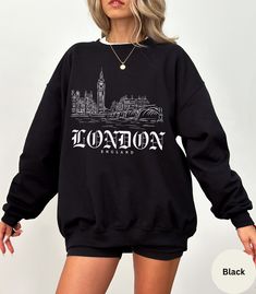 Stay cozy in our Unisex London Sweatshirt! Embrace city vibes with this stylish London Hoodie. Perfect travel sweatshirt and London gift souvenir, featuring iconic London England design. 🇬🇧  ✦ KEY FEATURES Gildan 18000 ADULT Crewneck Sweatshirt UNISEX (NOT WOMEN'S SIZE) heavy blend crewneck sweatshirt made from 50% Cotton and 50% Polyester. Loose fit, runs true to size. Strong, resistant to most chemicals, stretching and shrinking.  ✦ KEY FEATURES Gildan 18500 ADULT Pocketed Hoodie UNISEX (NOT WOMEN'S SIZE) heavy blend hooded sweatshirt made from 50% Cotton and 50% Polyester. Classic fit, RUNS TRUE TO SIZE. Medium-heavy fabric. Polyester fibers are extremely resilient, resistant to most chemicals, stretching, and shrinking. ✦ SIZING Please refer to the sizing chart in the pictures above Winter Graphic Print Crew Neck Hoodie, Urban Crew Neck Winter Tops, Urban Winter Crew Neck Tops, Casual Relaxed Fit Sweatshirt For Urban Adventures, Urban Sweater With Graphic Print For Fall, Winter Loungewear Sweatshirt With Screen Print, Urban Slogan Tops For Fall, Urban Graphic Print Sweater For Fall, Casual Sweatshirt For Urban Adventures In Fall