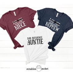 Funny shirts for that Aunt/Uncle Niece/Nephew sets! This listing is for ONE SHIRT.  - Select the size, add personalization info, click 'Add To Cart', then go back to this listing and repeat for 2nd size.  - Reference size charts carefully, keeping in mind that the sizing table only contains measurements for one side of the garment, not the circumference. Choose size(s) from drop-down menu. - Please allow 7 - 14 business days for processing and shipping. -Bella and Canvas Tees are a buttery-soft Matching Aunt And Nephew Shirts, White Tri-blend Top With Funny Print, Funny Aunt Shirts, Auntie Things, Sloped Shoulders, Nephew Shirts, Aunt And Niece, Uncle Tshirt, Aunt Shirts