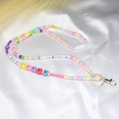 Custom name lanyard is a bead teacher lanyard. This pastel rainbow fun lanyard is special gift for teacher. It can be a badge necklace or badge holder. Colorful lanyards are the perfect addition to your summer jewelry collection. Add some pop color to any outfit when you wear this fun lanyard set. You can choose several length. Extra small: 24'' Small: 30'' Medium: 32'' Large: 34'' W H Y - Y O U ' L L - L O V E - I T ♥ * It's dainty can be worn every day * A special piece you'll treasure * High Badge Necklace, Custom Lanyards, Teacher Badge, Pop Color, Teacher Lanyard, Pink Box, Gift For Teacher, Badge Holder, Summer Jewelry