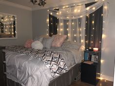 a bed that has some lights on it