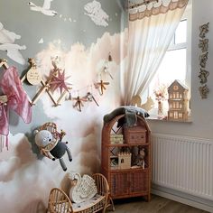 a child's room with wallpaper and decorations on the walls