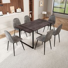 a dining room table with six chairs and a rug on the floor in front of it