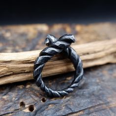 Black, twisted iron ring perfect gift for a man, boyfriend or husband. Made using traditional blacksmithing techniques of fire, hammer and anvil.  Surface texture is achieved through different shaped hammers and hand held chisels and profiling tools. The ring sealed with a clear wax for protection. US size- 10 1/2 Width - up to 7mm This original handiwork can become a exclusive, nice piece of your style. Presented in a gift bag.  European & International orders are sent by Standard post with tra Hand Forged Black Rings For Anniversary, Norse Ring, Iron Anniversary Gifts, Unique Mens Rings, Iron Jewelry, Anniversary Gift For Husband, Iron Ring, Anniversary Gifts For Husband, Gift For Husband