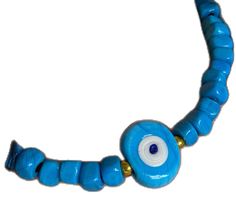 Turquoise Evil Eye Bracelet With Round Beads, Turquoise Evil Eye Bracelet With Round Beads As Gift, Handmade Blue Amulet Beaded Necklace, Traditional Blue Turquoise Necklace With Large Beads, Spiritual Turquoise Evil Eye Bracelet With Round Beads, Spiritual Turquoise Necklace With Round Beads For Beach, Blue Amulet Style Hand-strung Necklace, Blue Handmade Amulet Necklace, Blue Beaded Amulet Style Turquoise Necklace