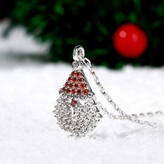 Our Santa Claus necklace is a great way to show your Christmas spirit and even if you don't catch a glimpse of Santa and his reindeer on Christmas eve you'll still have this amazing Christmas necklace to show how thankful you are for all the gifts he brings! The shimmering Santa pendant necklace sparkles with glittering white and red stones and will add some whimsy to your holiday outfit.Carat Weight: 1.989 ctStone Size: 1.1,1.4,1.6,1.6,1.4 mmStone Type: Jeulia® StoneNumber of Stones: 54 Stone S Santa And His Reindeer, Jewelry Manufacturer, Christmas Necklace, Color Stones, Santa Gifts, Red Green Yellow, Jewelry Manufacturers, Red Ruby, Secret Santa Gifts