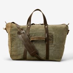 Created with heritage in mind, each of these bags is crafted from authentic salvaged military canvas, meaning each is entirely unique. Built to withstand another 50 years of adventures, this travel bag features 100% full-grain leather detailing, including brass hardware. An internal pocket enhances organization, while the detachable, adjustable leather strap with a shoulder pad ensures a comfortable carry during your journeys..View Repurposed Military Travel Bag by WP Standard on our site for mo Adventure Khaki Bags With Waxed Finish, Khaki Adventure Bags With Waxed Finish, Khaki Adventure Bag With Waxed Finish, Khaki Waxed Finish Adventure Bag, Khaki Canvas Travel Bag, Military Style Rectangular Travel Bag, Vintage Leather Weekender Bag With Leather Trim, Travel Canvas Bag With Luggage Sleeve In Waxed Canvas, Vintage Weekender Bag For Travel