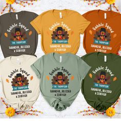 CREATE UNFORGETTABLE THANKSGIVING MEMORIES 🍂 with our personalized family shirts! ✨ About: Personalized Thanksgiving Shirts for Families Unique "Gobble Squad - Thankful, Blessed & Stuffed" design with custom family name. Perfect for Thanksgiving dinner, family gatherings, and memorable photos. High-quality prints on super comfortable shirts and sweatshirts. 👉 PREMIUM QUALITY OPTIONS: Bella Canvas: Soft, stylish t-shirt with a modern fit. 👕 PRODUCT DETAILS: Sizes: S-2XL. Styles: T-shirt, Long Family Thanksgiving Shirts, Dinner Family, Turkey Thanksgiving, Family Thanksgiving, Funny Family, Squad Shirt, Thanksgiving Shirt, Family Humor, Sweat Shirts