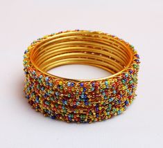 Bangle Set of 12 for Women/Girls. Perfect gift for any occasion for yourself and your dear ones. It is advisable to store jewellery in a zip lock pouch (air tight pouch), keep away from water perfume and other chemicals and clean it with dry and soft cloth. Indian Wedding Bangles, Indian Bangles Set, Bridal Jewellry, Wedding Bangles, Lehenga Red, Indian Bangles, Water Perfume, Bridal Lehenga Red, Bangles Set