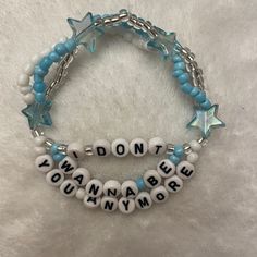 these handmade bracelets inspired by billie eilish's discography are the perfect gift for a billie fan you know Trendy Handmade Jewelry For Concerts, Trendy Bracelet Jewelry For Concerts, Trendy Customized Blue Beaded Bracelets, Adjustable Blue Kpop Bracelets, Handmade Adjustable Jewelry For Concert, Trendy Handmade Jewelry For Streetwear, Trendy Handmade Streetwear Jewelry, White Adjustable Rave Jewelry, Trendy Customizable Blue Bracelets