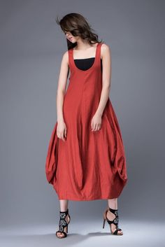 Super feminine and comfortable, this casual red linen dress is a must-have for any summer wardrobe.  Wear it with chunky boho jewelry for a casual look and relaxed vibe. You'll create an entrance wherever you go with this incredibly versatile linen dress.  Sleeveless, loose-fitting and flaunting a gorgeous tulip-shaped hemline, the dress is suitable for any shaped lady.  This is a really versatile but unique designer dress.FEATURES- 100% Linen- Sleeveless- Lower Round Neckline- No zipper-Loose f Red Linen Bohemian Dress, Red Bohemian Linen Dress, Red Linen Dress For Spring, Casual Red Linen Dress, Red Linen Maxi Dress For Summer, Red Lagenlook Summer Dress, Red Lagenlook Dress, Red Linen Summer Dress, Sleeveless Red Linen Dress For Summer