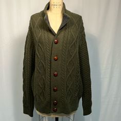 Barbour Cable Knit Olive Green Sweater Size Large Excellent Condition Leather Buttons Lamb’s Wool Green Cable Knit Sweater Coat, Cold Weather Merino Wool Cable Knit Cardigan, Cold Weather Cable Knit Merino Wool Cardigan, Cable Knit Merino Wool Cardigan For Cold Weather, Classic Green Textured Knit Sweater, Casual Merino Wool Sweater With Buttons, Classic Green Cable Knit Sweater, Green Wool Cable Knit Sweater, Olive Green Sweater