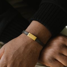 The Grady is a handmade bracelet featuring a slim cowhide leather strap. The design is comfortable, minimalist, straightforward, and stylishly refined.- WIDTH: 8 mm- MATERIAL TYPE: 100% genuine pebbled cowhide leather- CLASP COLOR: Brushed gold- CLASP MATERIAL: 316L stainless steel, 18K gold PVD plated- CLASP TYPE: Magnetic Gold Armband, Jewelry For Men, Bracelet Cuir, Black Edition, Handmade Bracelet, Leather Band, Handmade Bracelets, Cowhide Leather, Arm Band