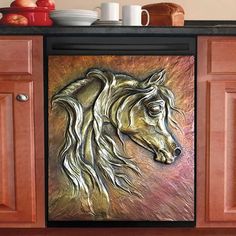 a painting of a horse on the side of a kitchen cabinet in front of a counter