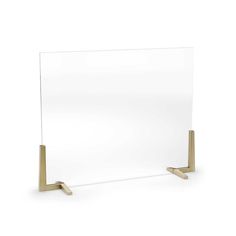 a white glass and brass frame on a white background