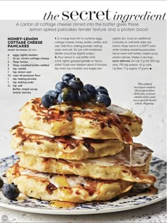 a stack of pancakes with blueberries on top