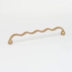 a brass handle on a white background