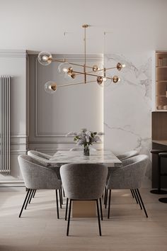 an elegant dining room with marble table and chairs