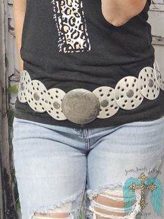 Lasso in that western look with our Silver Eyelet Round Western Belt! Made with faux leather and silver accents, this belt will add a touch of edgy style to any outfit. 40" in length from buckle to end of belt Southwestern Style Concho Belt For Festivals, Western Antique Belt Buckles For Festival, Western Silver Belt With Antique Buckle, Silver Adjustable Belt For Rodeo, Silver Antique Buckle Belt For Festival, Antique Silver Belt Buckle For Festival, Silver Belt Buckles For Rodeo, Festival Silver Concho Belt, Trendy Silver Belt Buckle With Belt Included