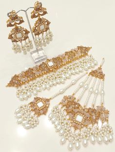 an assortment of pearls and gold jewelry